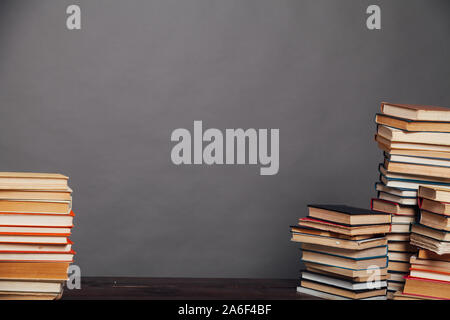 a lot of different educational books on a gray background Stock Photo