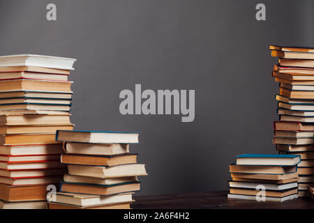 a lot of different educational books on a gray background Stock Photo