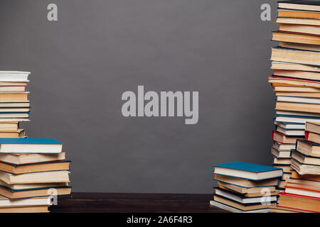 a lot of different educational books on a gray background Stock Photo
