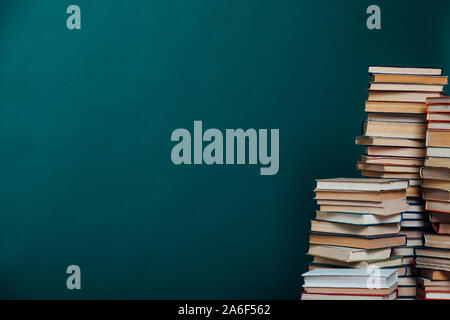 school a lot of different educational books on a green background Stock Photo