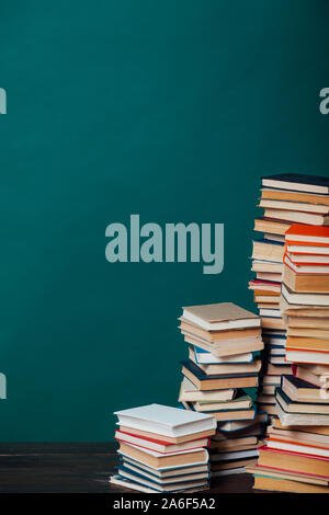 school a lot of different educational books on a green background Stock Photo