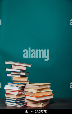 school a lot of different educational books on a green background Stock Photo
