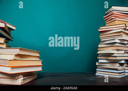 school a lot of different educational books on a green background Stock Photo