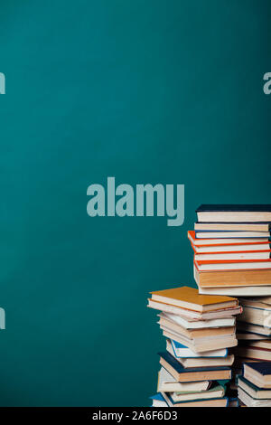 school a lot of different educational books on a green background Stock Photo