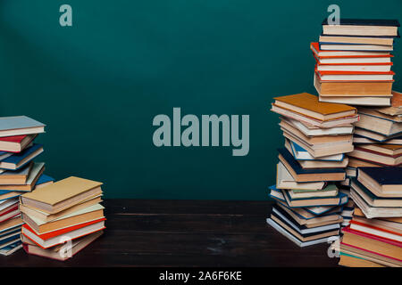 school a lot of different educational books on a green background Stock Photo
