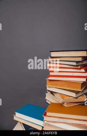 a lot of different educational books on a gray background Stock Photo