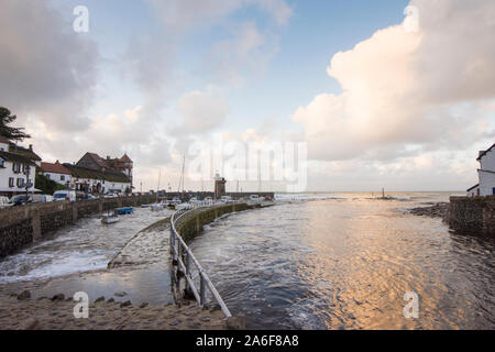 view over the harbour and river mouth at Lynmouth to the sea during stormy weather, tide in, Devon, UK. September Stock Photo