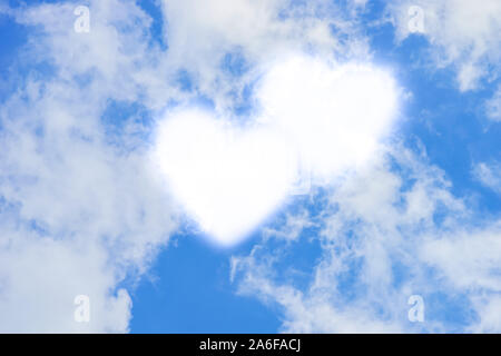 Blue sky with white clouds in hearts shape. Stock Photo