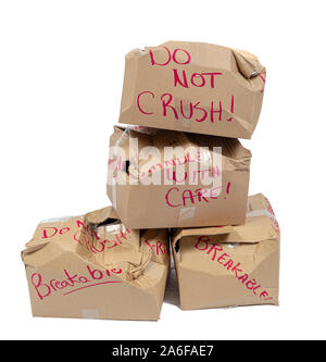 Vertical shot of four stacked do not crush boxes crushed.  Isolated on white. Stock Photo