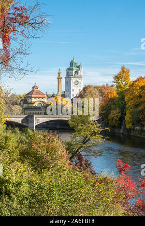 Autumn (October). Munich, Bavaria, Germany. View of Isar river and the art noveau Mullersches Volksbad swimming pool building in the background. Stock Photo