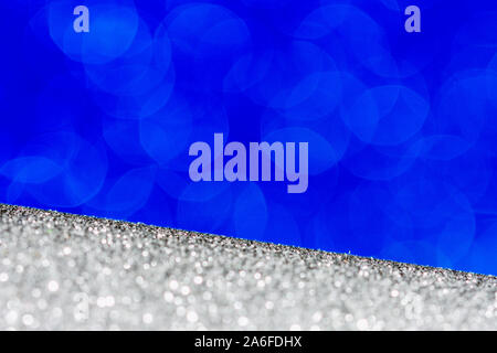 blue and silver festive abstract background with bokeh, copy space greeting card, defocused glitter effect Stock Photo