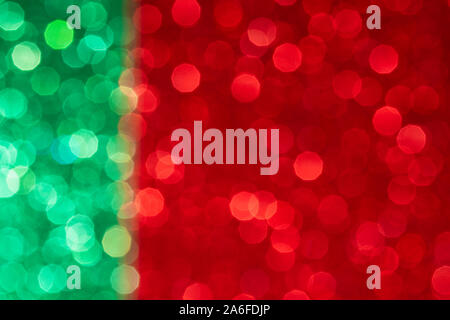 green and red abstract background with bokeh, patriotic flag with defocused glitter effect, glowing greeting card with copy space Stock Photo