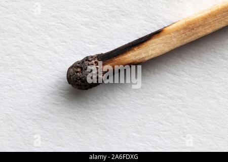 A used match on a white background Stock Photo