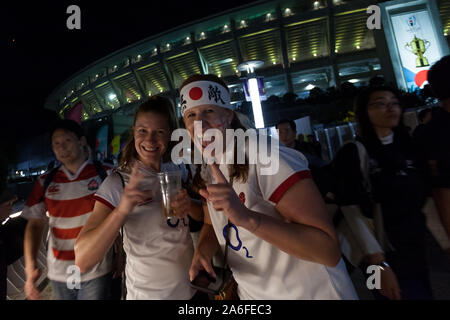 Two American women supporting England with other rugby fans outside the Yokohama International Stadium after the Rugby World Cup semi-final clash between England and New Zealand. Yokohama, Japan. Saturday October 26th 2019. The championship favourites, New Zealand were beaten by the England team, 19 to 7. allowing England to reach its first world cup final since 2007 Stock Photo