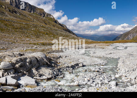 Torrent and sheepback rocks near Untersulzbachkees glacier.  Untersulzbach valley. Glacial alpine valley. Hohe Tauern National Park. Austrian Alps.
