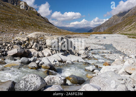 Torrent and sheepback rocks near Untersulzbachkees glacier.  Untersulzbach valley. Glacial alpine valley. Hohe Tauern National Park. Austrian Alps.