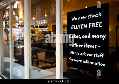 Gluten free option chalked on blackboard outside restaurant premises Stock Photo
