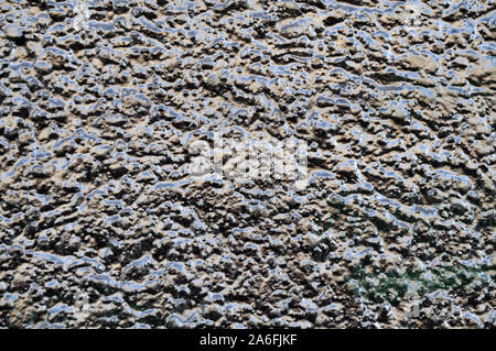facade with plastered wall painted with silver color showing metallic glitter Stock Photo