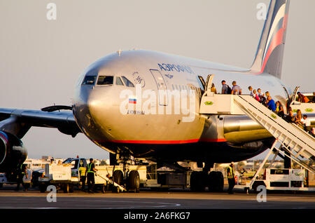 Sharm El Sheikh, Egypt - November 09, 2012. Tourists boarding in to the plane Stock Photo