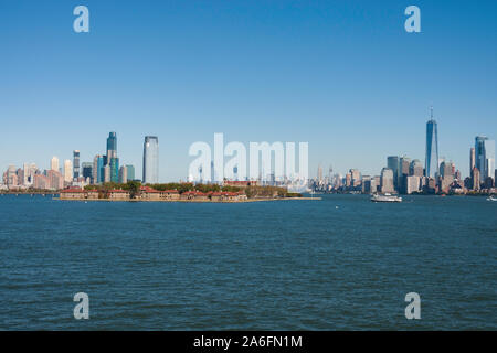 Ellis Island in the foreground with skylines of New Jersey and Manhattan in the background, NYC, USA Stock Photo