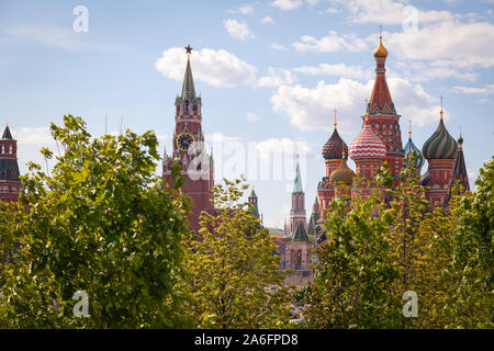 Russia Moscow 2019-06-17 summer view of the Spasskaya Tower with a clock chimes and St. Basil’s Christian Cathedral from Zaryadye Park. Concept touris Stock Photo
