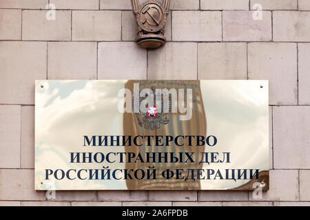 Russia Moscow 2019-06-17 Gold shiny signboard of Ministry of Foreign Affairs with Russian flag, flag of MID of Russia and inscription plate on Russian Stock Photo