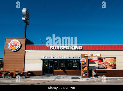 Madrid, Spain - Oct 26, 2019: Outside a fast-food Burger King restaurant with a sleek, contemporary futuristic industrial look includes brick cladding Stock Photo