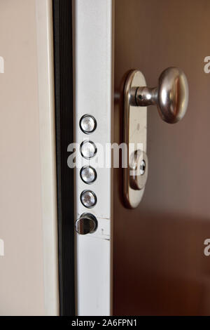 High security multiple deadbolts European style door and lock mechanism on open apartment door Stock Photo