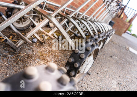 Golf carts for hire, ready for golfer to put their clubs on and go around the course Stock Photo