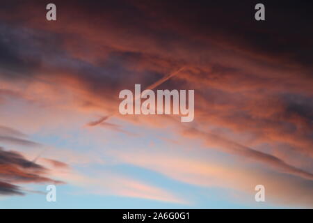 Colored clouds hovering in the sky during a Colorado Sunset Stock Photo