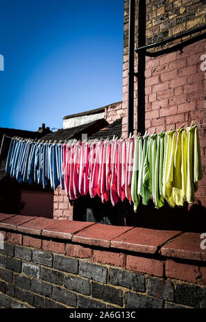 Cleaning cloths on a clothes line washed and ready for action again. Cleaning business, work, cleaning, Fenton, Stoke on Trent, poor, poverty, working Stock Photo