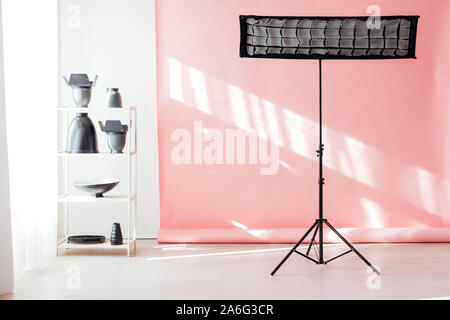 Photo studio equipment accessories photographer flashes on pink background Stock Photo