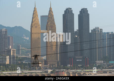 The cable car in Chongqing in China. The cable car is used by both locals and tourists. The cable car crosses over the Jialing River. Stock Photo