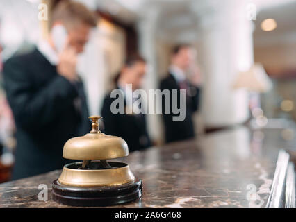 Hotel service bell Concept hotel, travel, room,Modern luxury hotel reception counter desk on background Stock Photo
