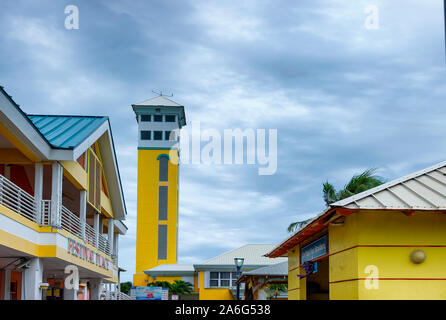 Nassau, Bahama - September 21/2019: Yellow tower under stormy skies at Nassau,Bahama's Port Terminal Stock Photo