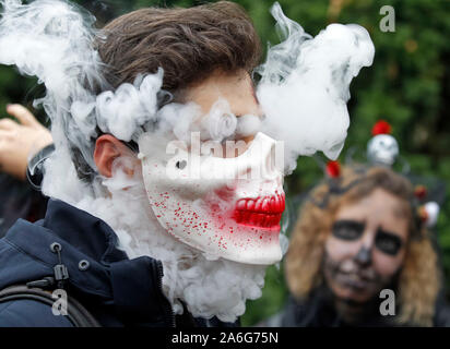 halloween costume cigarette A participant wearing a mask smoking electronic cigarette attend the  Halloween parade in Kiev. Hundreds of zombies staggered through the inner  city in search of fresh brains during the Halloween Parade. Halloween
