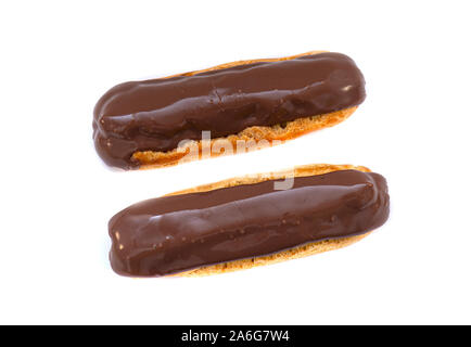French Eclair with Chocolate brown Glaze. Eclairs with Custard isolated on white Background, top View Stock Photo