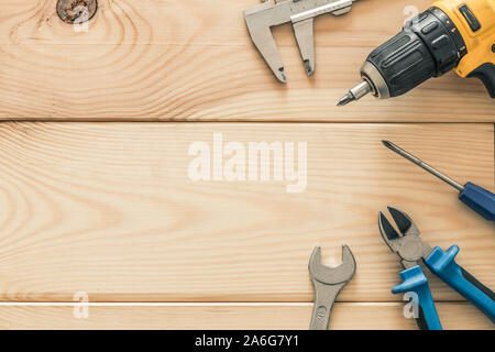Workshop tools on a wooden board Stock Photo