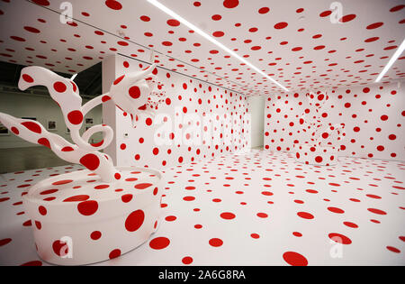 Los Angeles, USA. 25th Oct, 2019. Photo taken on Oct. 25, 2019 shows artist Yayoi Kusama's installation 'With All My Love for the Tulips, I Pray Forever' in Los Angeles, the United States. 'With All My Love for the Tulips, I Pray Forever' is an installation that features polka-dotted potted tulips in a room in which the walls, floor and ceiling have been covered in the same signature red polka dots. Credit: Li Ying/Xinhua/Alamy Live News Stock Photo