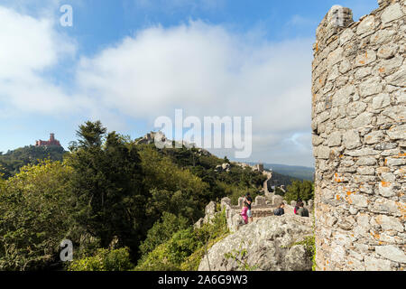 Scenic view of the Pena Palace (Palacio da Pena) and medieval hilltop castle Castelo dos Mouros (The Castle of the Moors) in Sintra, Portugal. Stock Photo