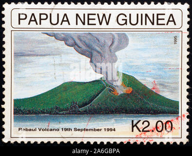 Vulcanic eruption on postage stamp of Papua New Guinea Stock Photo