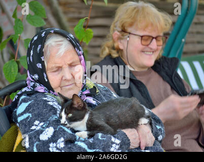 Elderly woman with middle aged daughter Stock Photo