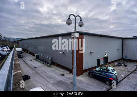 CCTV cameras overlooking a factory car park in the poverty stricken district of the city Stock Photo