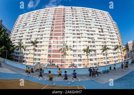 Schoolchildren carry out their athletics training on the Choi Hung Estate in Hong Kong Stock Photo
