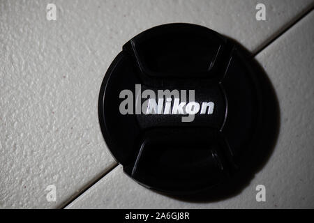 Nikon lens cap on a textured background Stock Photo