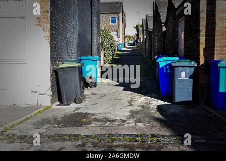 Discarded rubbish and overflowing bins in the back streets of Fenton, Stoke in Trent, recycling, bin collections, poor deprived area, neglected Stock Photo
