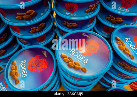 Tubs, tins of Cadbury roses chocolates on sale for Christmas at a large supermarket chain Stock Photo