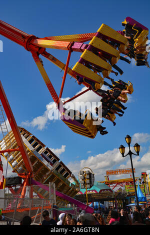 Spinning swings at fair Stock Photo - Alamy