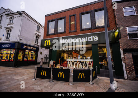 People enjoy a nice warm McDonalds meal outside after shopping in the January and Christmas sales on a cold January day Stock Photo