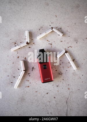 Vape device electronic cigarette aspire breeze, as smoking alternative with broken marlboro gold cigarettes and scattered tobacco on white textured ba Stock Photo - Alamy Vape device electronic cigarette aspire breeze, as smoking alternative with broken marlboro gold cigarettes and scattered tobacco on white textured ba Stock Photo - Alamy